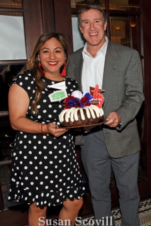 4. Kim Wright paused for a photo with Tom Burgoyne and her Bundt cake.