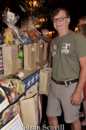 8. Rich Kaeble looked over all the raffle prizes.