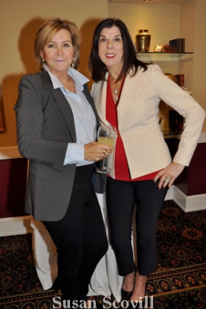 2. Maggie Hagstrom and Denise Bellisario shared a moment during the holiday luncheon.