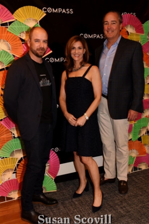 3. Gary Lacy, Sara Moyher and John Grady paused for a photo at the ''step and repeat''..