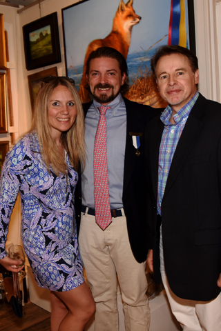5. Jessica Miller, Tim Zupko and artist Shawn Faust paused for a photo in front of his winning entry "Beachcomber"