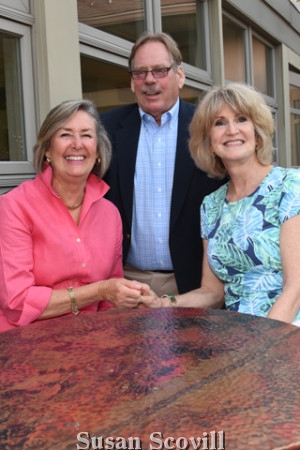 13. Laurie McGrath chatted with Mark and Patti Hallowell.