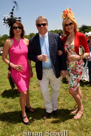 5. Sara Cortese and Tim Carney paused for a photo with Sandra Yodesky (left) who won the "best hat" competition.