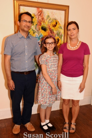 2. Lilla Tsvetkova (center) joined her parents Lyuben and Rumiana Tsvetkova for a photograph at the event.