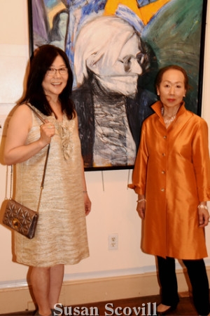 3. Gee Shin and Tomoko Torii pose with a Richard Ranck painting called "Gag Andy"