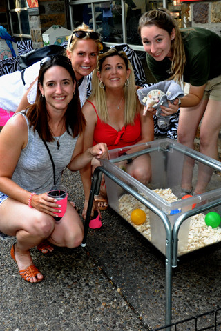 8. Philadelphia Zoo staff member Mara Galitski (right) introduced ''Topher'' to Kaitlin Maloney, Taylor Test and Justina Castleton during the Ale Fest.