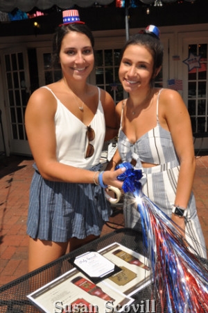 10. Hannah Wurzel and Veronica Plohoros prepared tables for the guests.