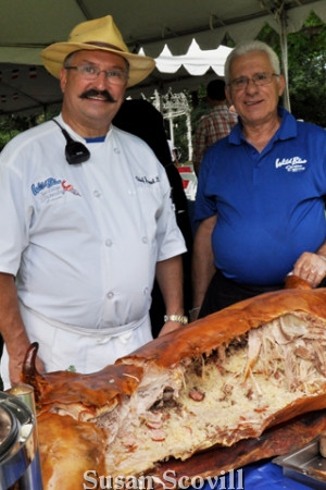 16: Wild Blue Creative Catering's president Joseph Koye and his assistant Izet Alie were pictured serving the pig roast!