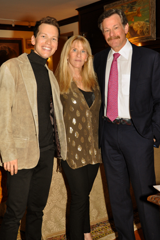 13. Garrett Snider, his mother Lindy Snider and Dr. Larry Kaiser paused for a photo during the event .