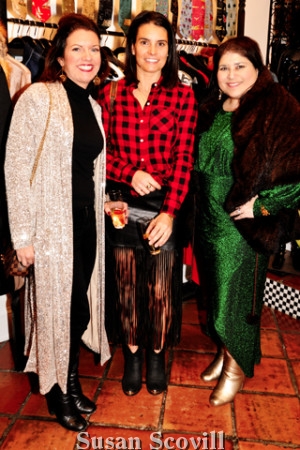 8. Nicole Klein and Stephanie Gambescia admired Jennifer Robinson's purchase - an elegant fur wrap,