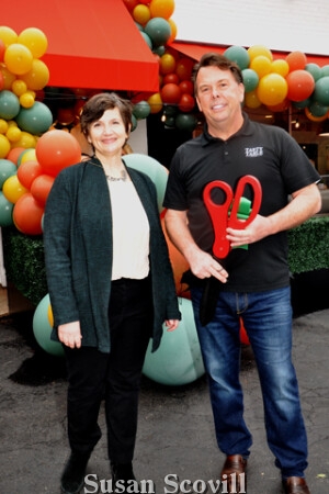 8. Main Line Chamber of Commerce Director of Member Services Xenia Scott paused for a photo with Tasty Table owner George McLoughlin following the ribbon cutting ceremony during the opening party.