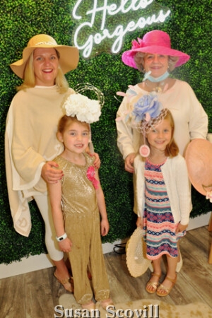 7. McGlade and Nicholas families paUsed for a photo in Boutique 30's dressing room