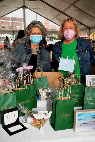 5. Saturday Club members Bernadette Nicholas and Kit Rothenberger manned this table of donated items