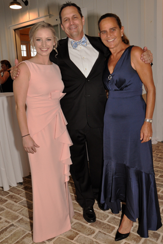 2. Mikaela Potrako and Jeff Parnell chatted with Caroline Moran during the fundraiser.