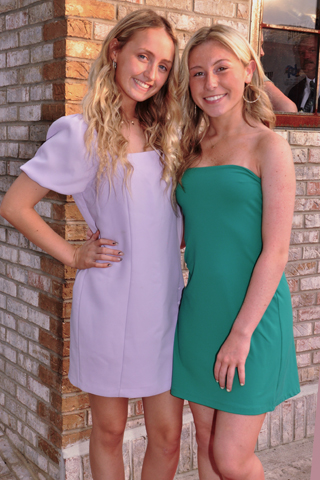 12. Erin Corbett and Grace Kane welcomed guests to the opening event.