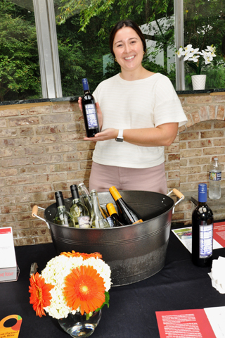 4. Emily Serkes event coordinator for Chaddsford Winery served samples of their wine to attendees.
