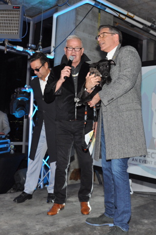 16. John Bolaris and Mike Jerrick got ready to introduce Jim Clark and his puppy Naomi, to the crowd around the runway!