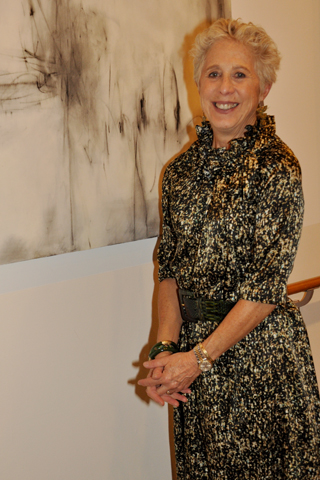 7. Artist Val Rossman paused for a photo with her entry called “In Contrast”.