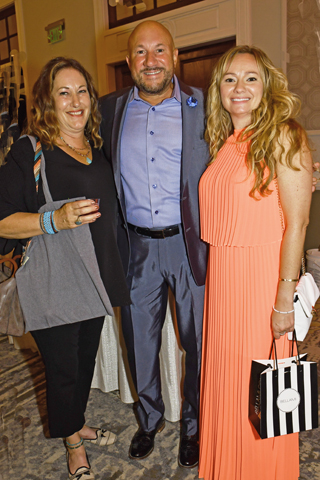 3. Andrea Gordon, Greg Basile and Lyndsay Rowland attended the event