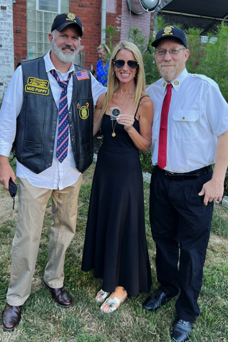 9. Rib Klein and Scott Carlson presented an honorary coin to publicist Leslie Padilla
