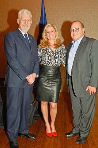 18. Edward Turzanski and his daughter Stephanie chatted with Allan Domb at the end of the luncheon