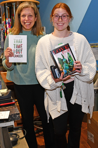 4. Leah O’Neill (right) made her purchase from Main Point Books owner Cathy Fiebach (left)