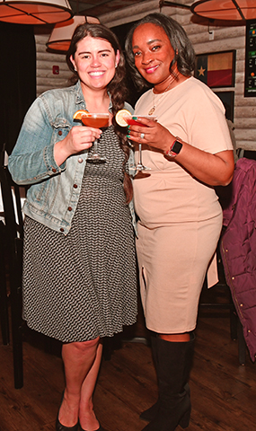 7. Elle Alba and LaToi Storr enjoyed a specialty cocktail at the event