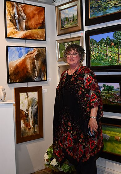 13. Artist Beth Bathe with her works of art