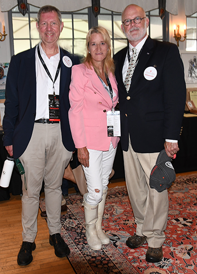6. Paul,Sloate, Laura Stacy and Ken Leith examined auction items in the clubhouse