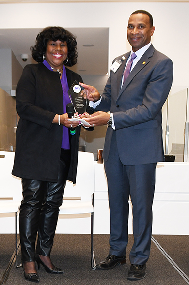 Joanne Craig received he award from Dr. Gobern