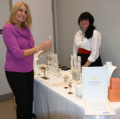 7. Jeanne Sonn stopped by the Kendra Scott booth and discussed a purchase with Kendra Scott Ardmore assistant manager Aimee Schwartz
