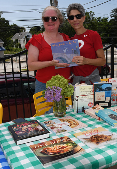 6. Sean McDernott of Oak Nut Farm brought his culinary harvest product to the event. "Tomato Guy, " Vlad Puskovitch joined Lizzy Friedman and Joshua Freed in a photo ''op'' as they made their purchases!