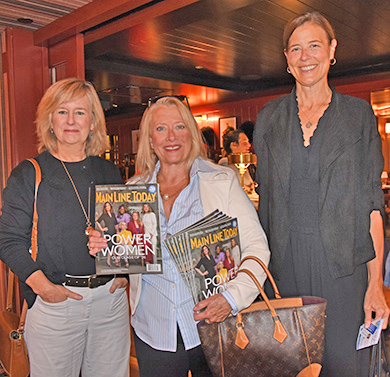 2. Sue McNamara (left) and Tricia Winton helped. Christine Hutkin distribute these Main Line Today copies! Suzy Pratowski